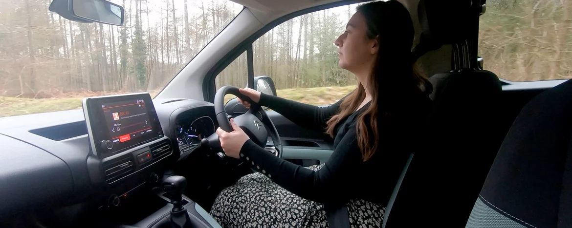 Woman driving Citroen Berlingo