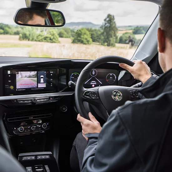 Man driving Vauxhall Mokka-e