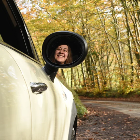 Young person driving mini cooper