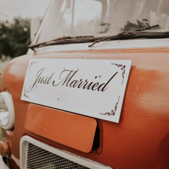 Just married sign on a car trunk