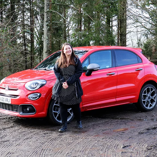 Woman stood beside Fiat 500X