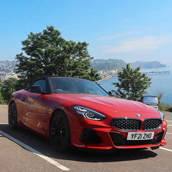 BMW Z4 parked under tree